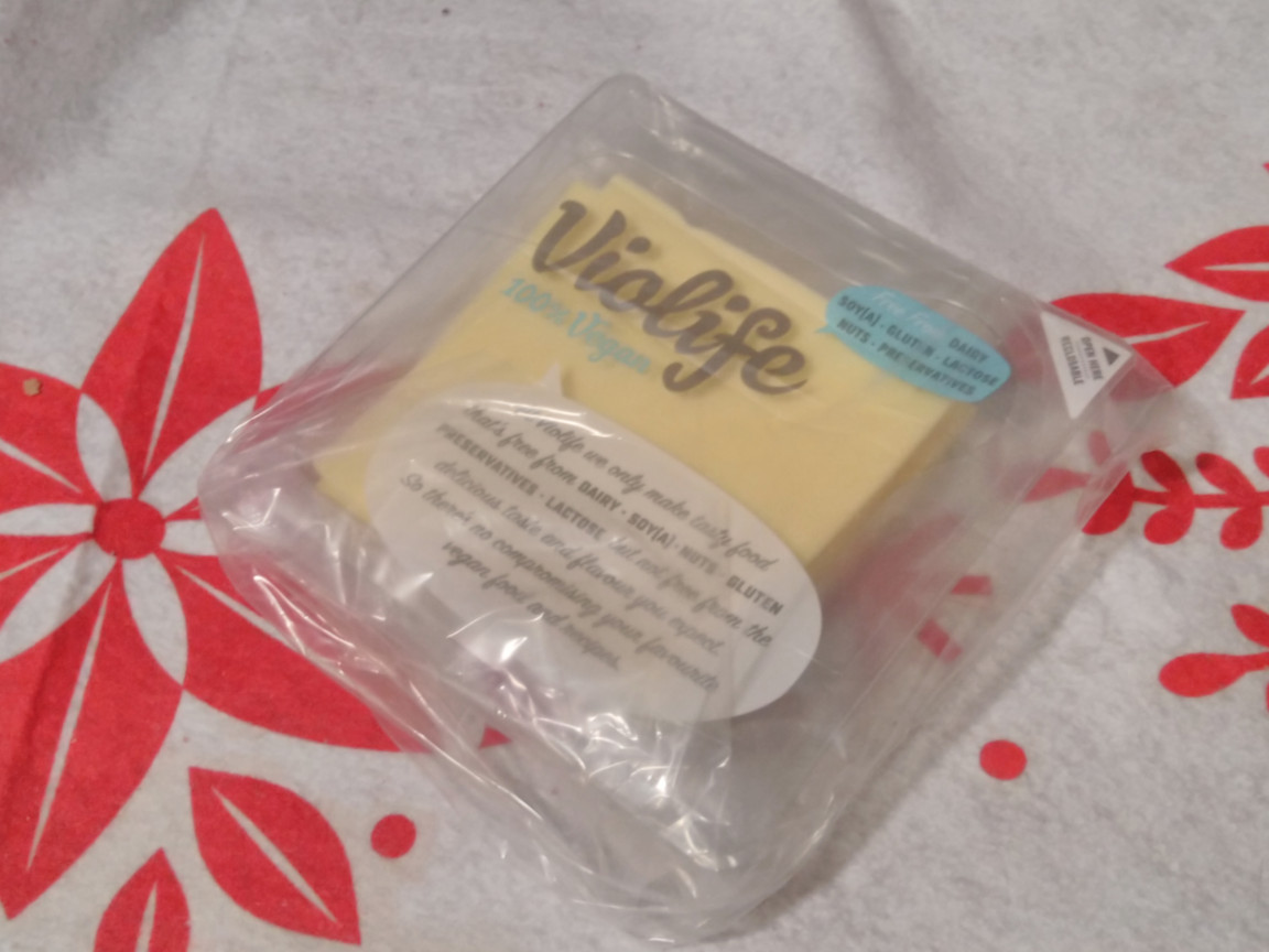 A package of cheese, wraped up in a plastic baggie